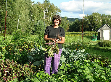 One of our beloved stewards, Kat, in the vegetable garden.